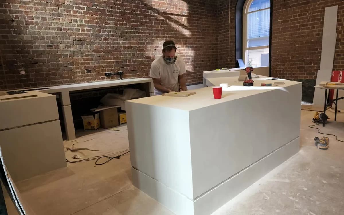 Hand finishing a cement-based surface